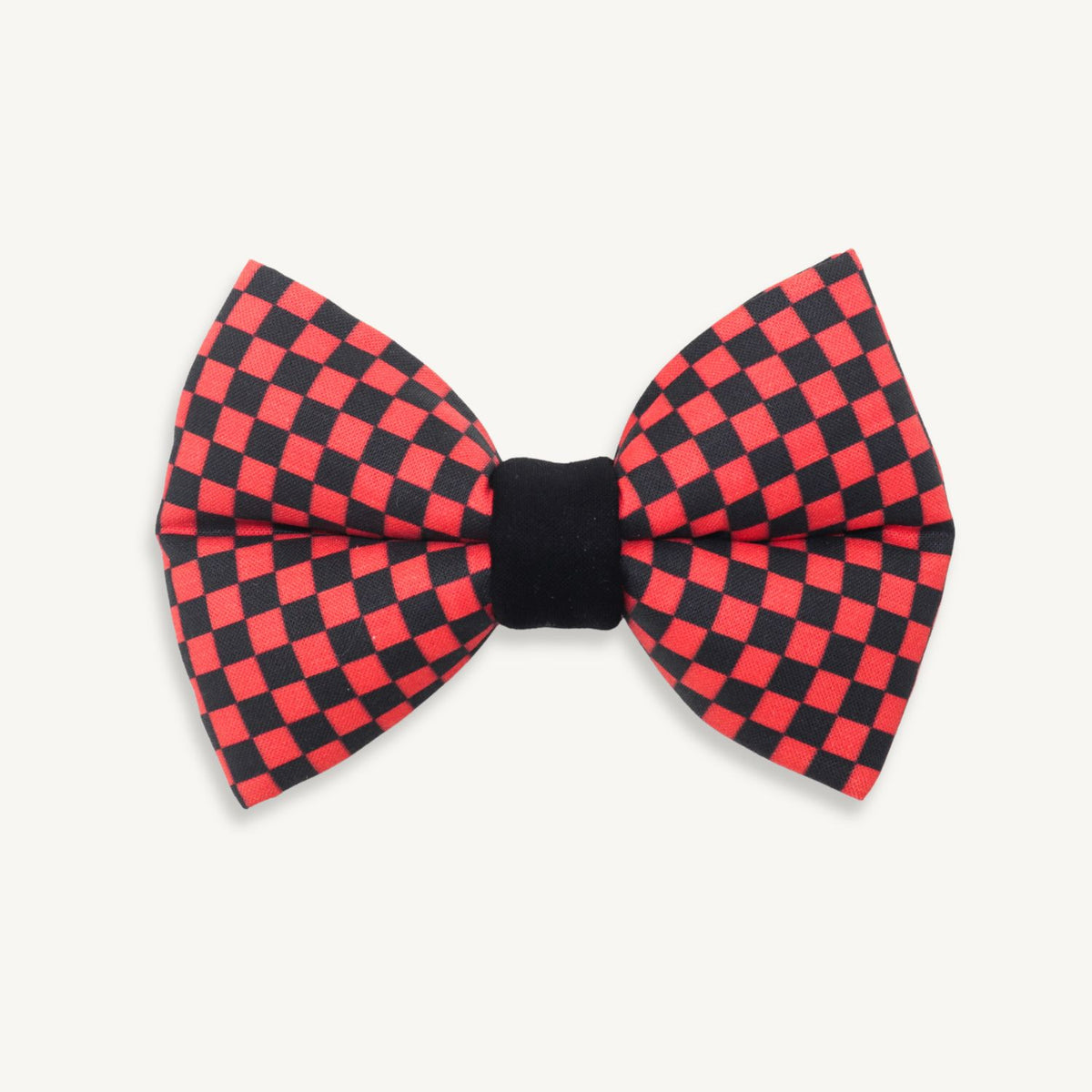 Handmade buffalo plaid dog bow tie featuring a classic red and black checkered pattern, designed to slide over a dog collar for a timeless rustic look.