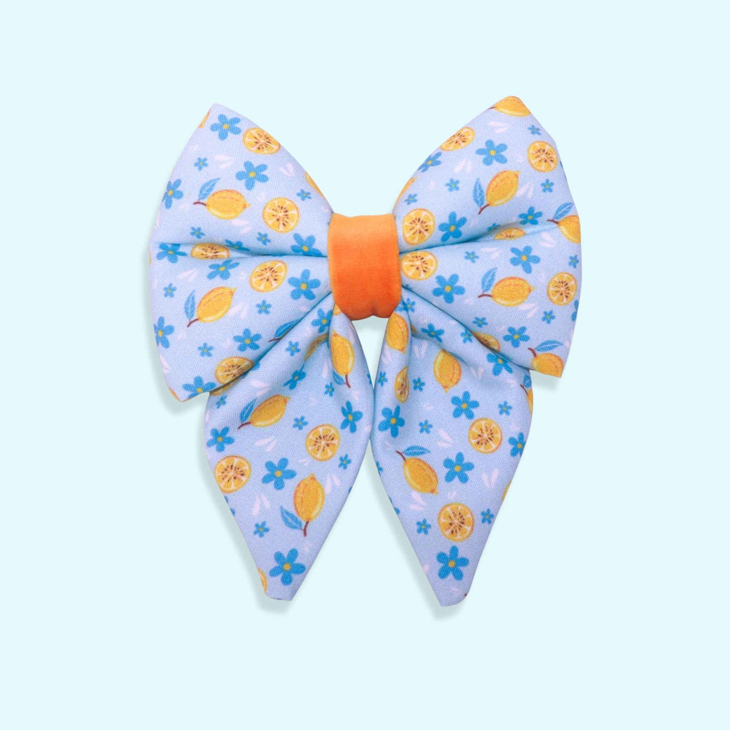 Lemon sailor dog bow with citrus pattern, blue flowers, and Mediterranean-inspired summer design from the Amalfi Breeze collection