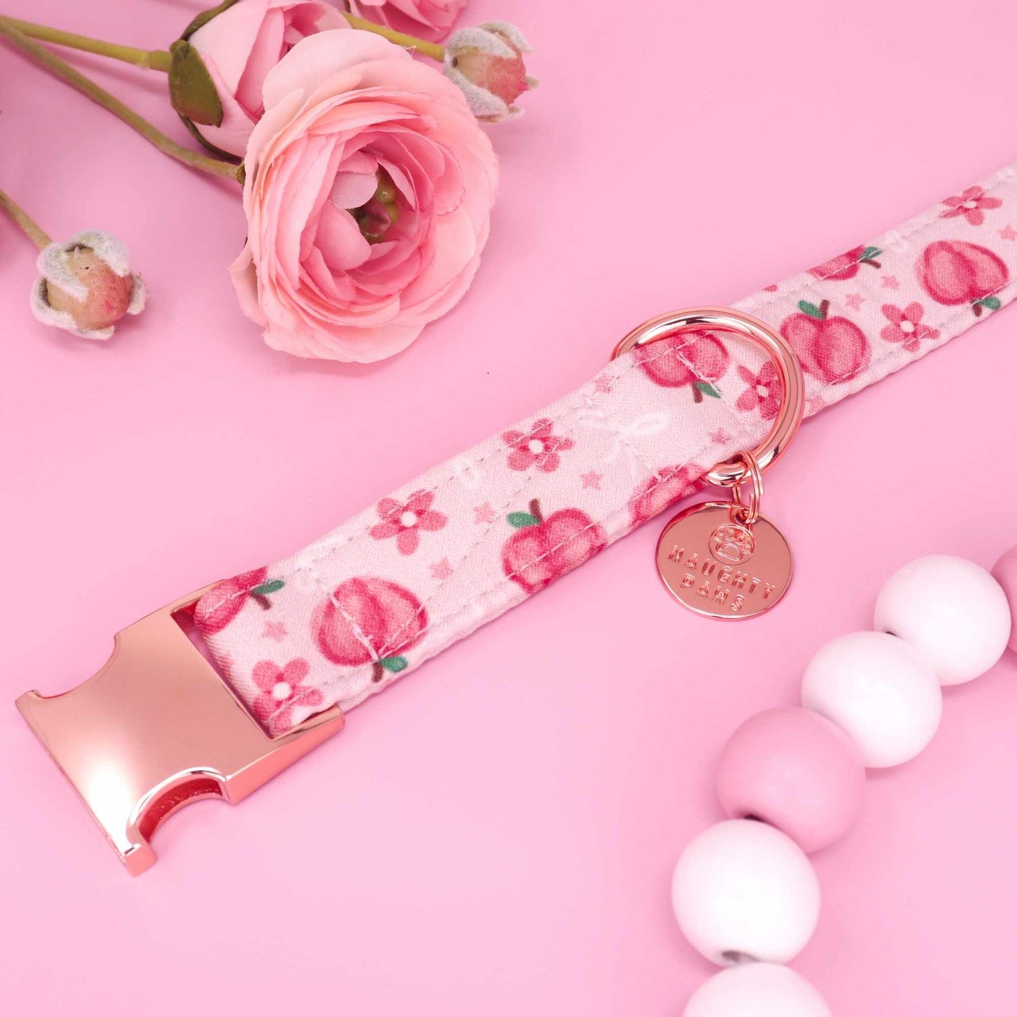 Handmade pink dog collar with peach print and feminine aesthetic