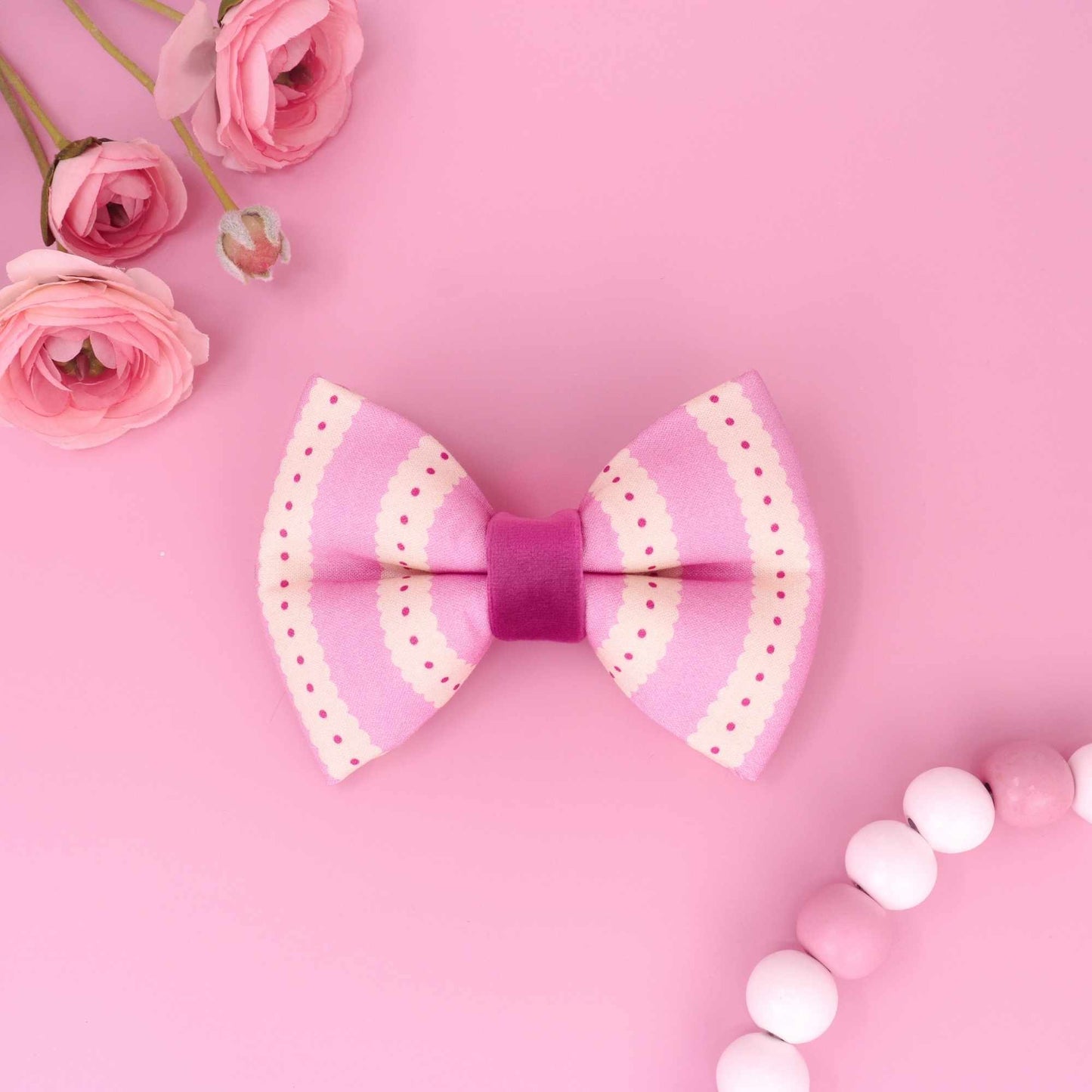 Handmade pink dog bow with scalloped pattern and coquette style