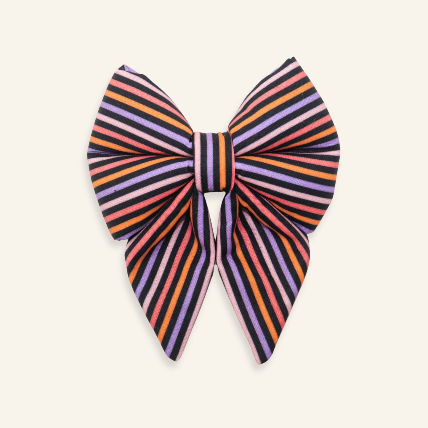 Handmade Halloween dog sailor bow with pink, orange, purple, and black striped fabric, designed as an over-the-collar accessory for dogs.