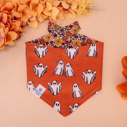 Golden Poppy reversible dog bandana with floral print on one side and orange ghost pattern on the other, handmade snap-on bandana for fall and Halloween pets