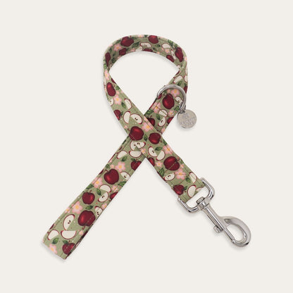 Sage green apple dog leash featuring red apples, apple slices, pink flowers and green leaves
