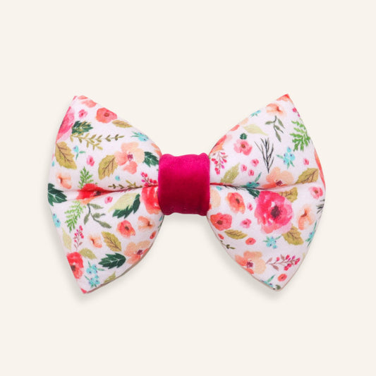 Handmade pink floral dog bow tie with romantic garden flower print and fuchsia center, cotton collar bow accessory for dogs and puppies.