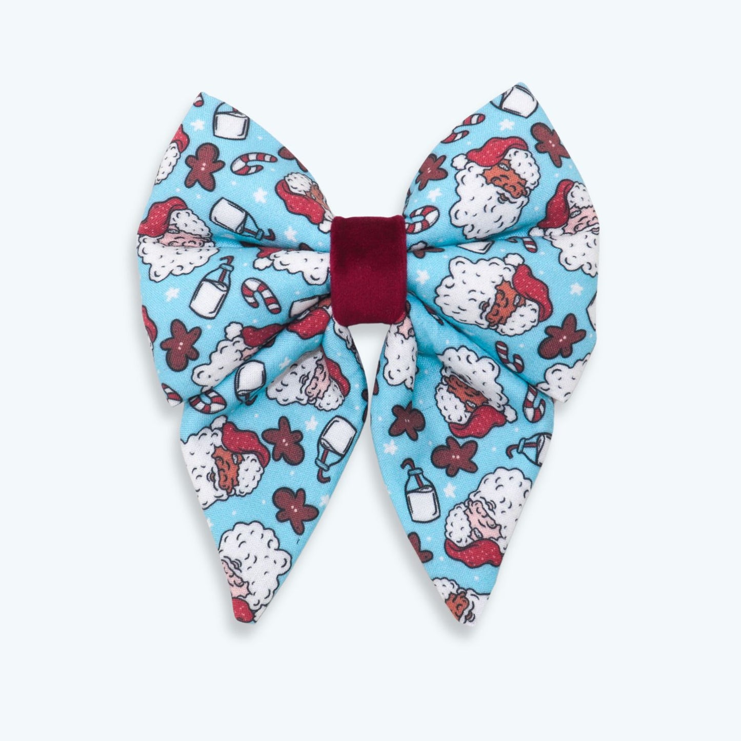 Handmade blue Christmas dog sailor bow featuring Santa Claus, gingerbread cookies, candy canes, and festive holiday treats, designed to slide over a dog collar for a cheerful holiday look.
