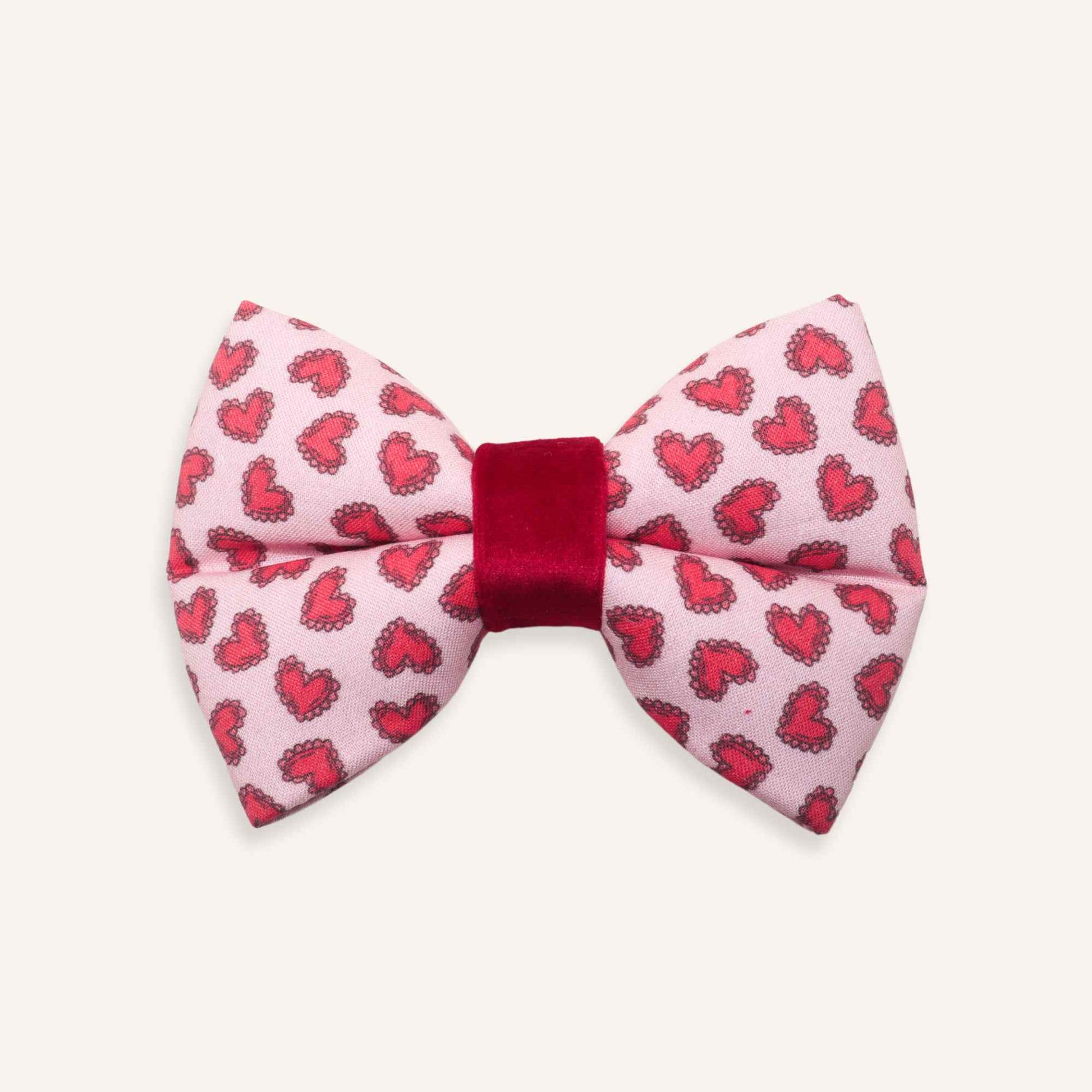dog Bow tie with red heart pattern on a pink background