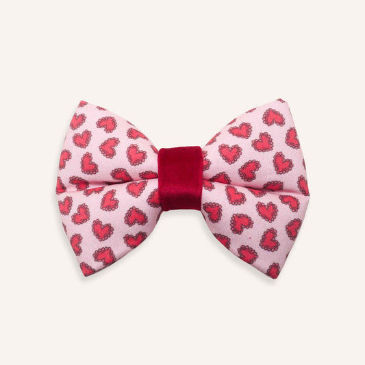 dog Bow tie with red heart pattern on a pink background