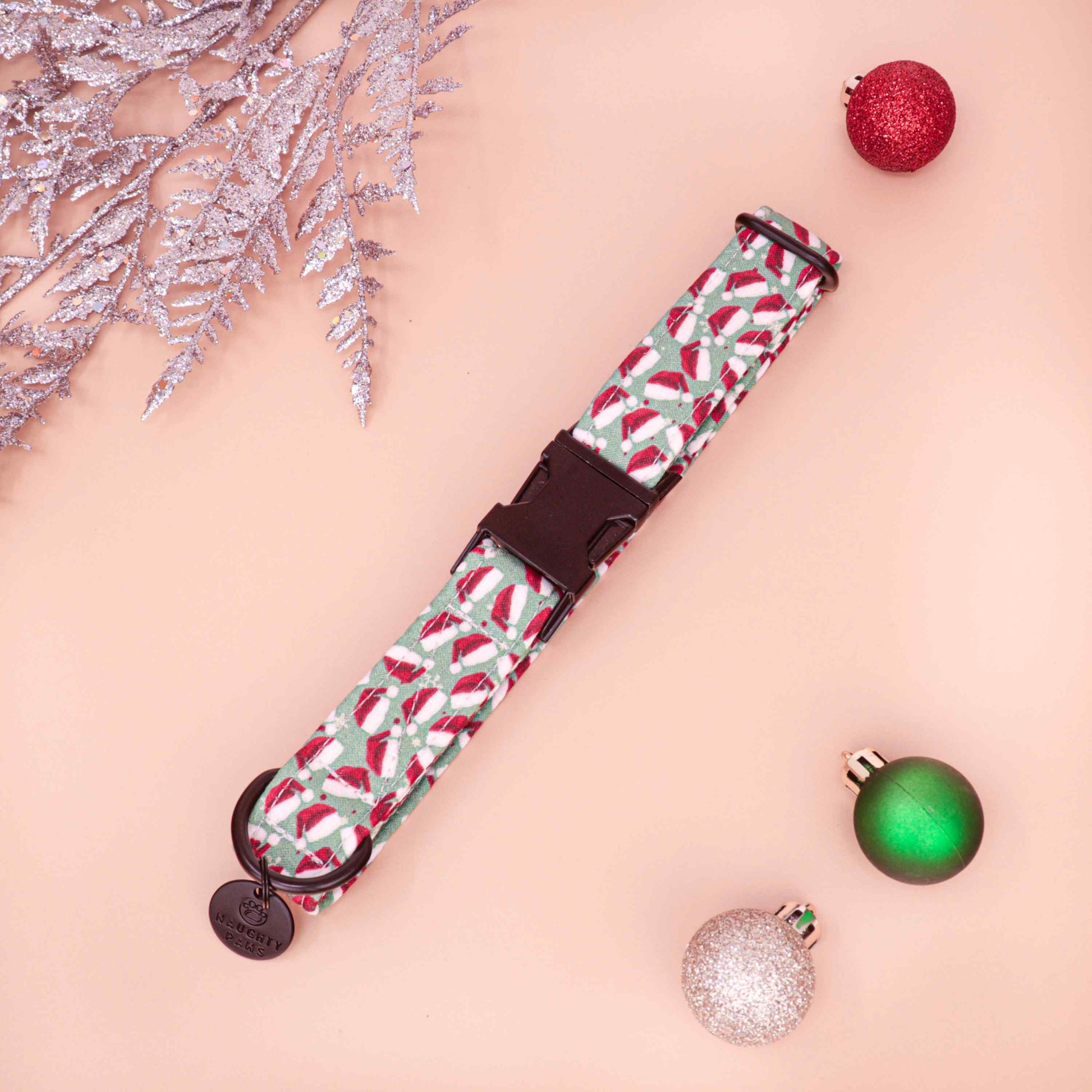 Christmas dog collar with Santa hat pattern on green fabric background