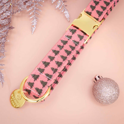 red dog collar with black tree pattern and gold hardware on a pink background
