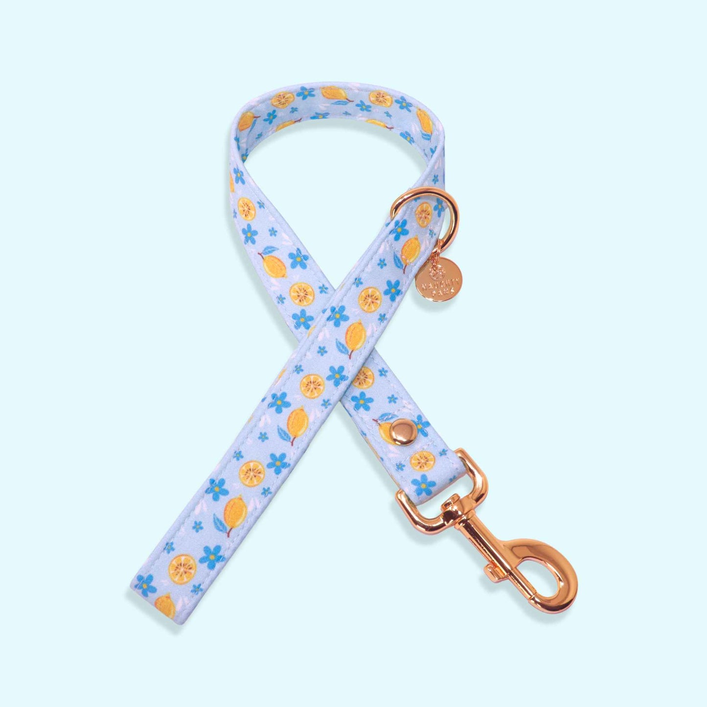 Blue lemon print dog leash with floral details and rose gold hardware from the Amalfi Breeze collection