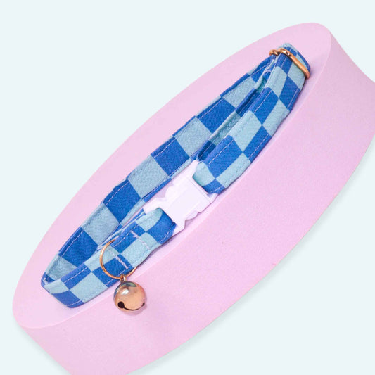 Blue gingham breakaway cat collar with blue checkered pattern, adjustable fit, rose gold hardware, and optional bell.