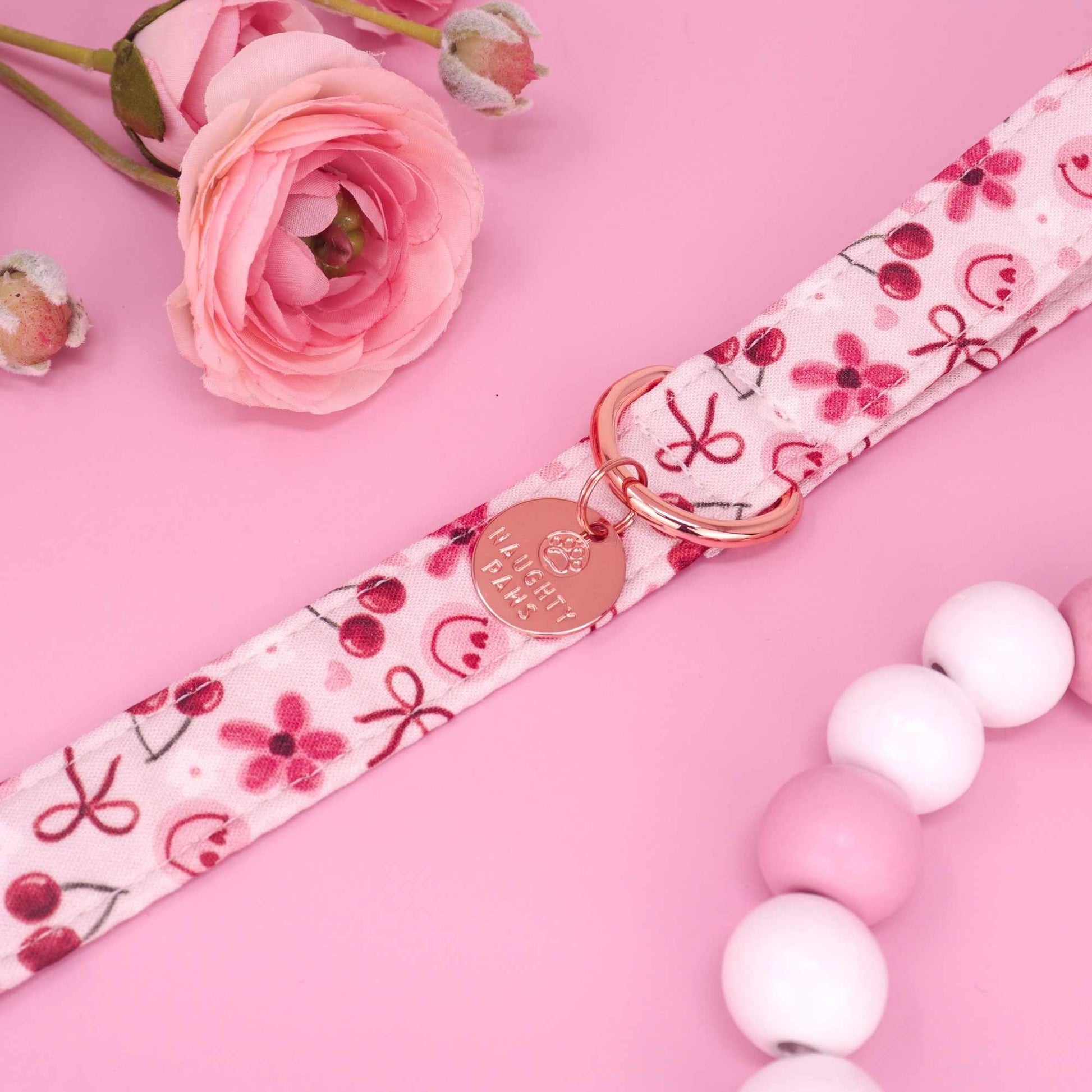 Cherry Delight pink dog leash with cherries daisies heart smiley faces and red bows

