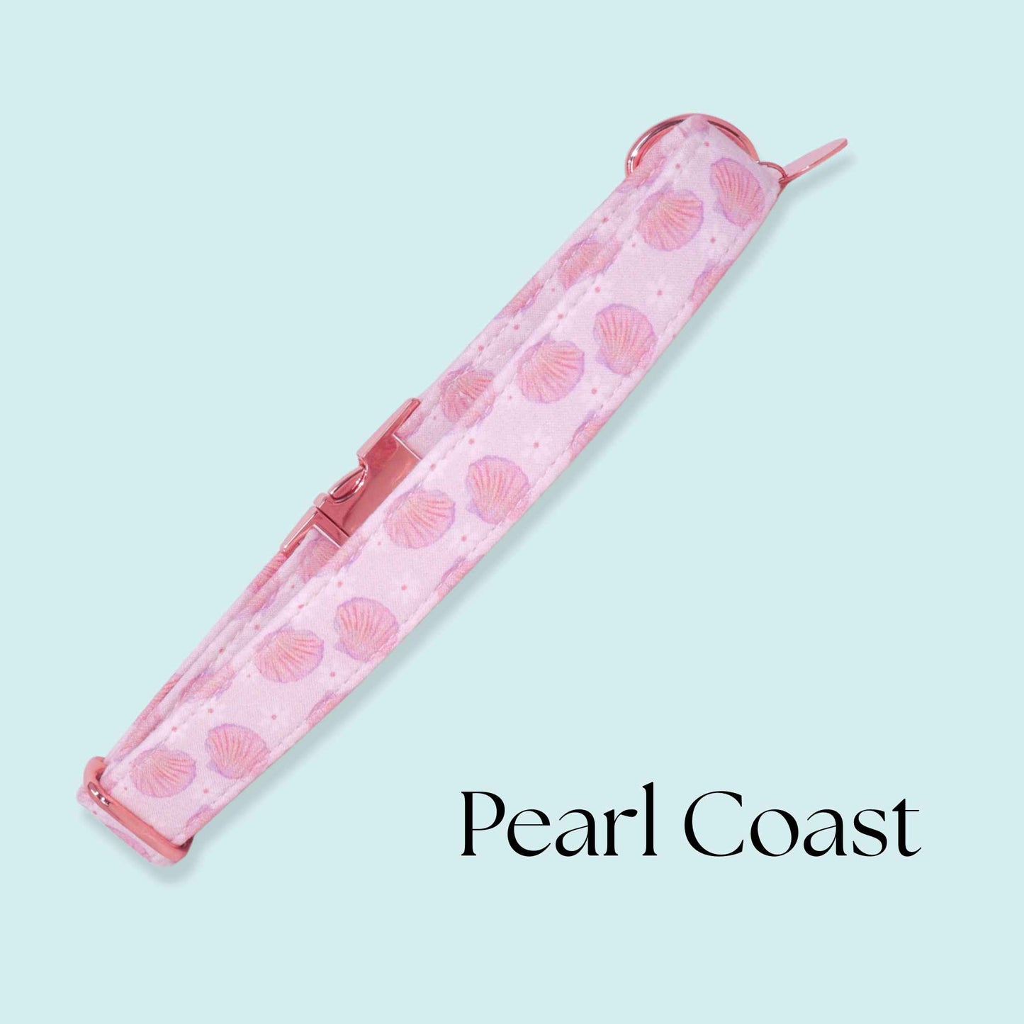 Handmade coastal dog collar with pink seashell print and rose gold buckle inspired by ocean and beach aesthetics