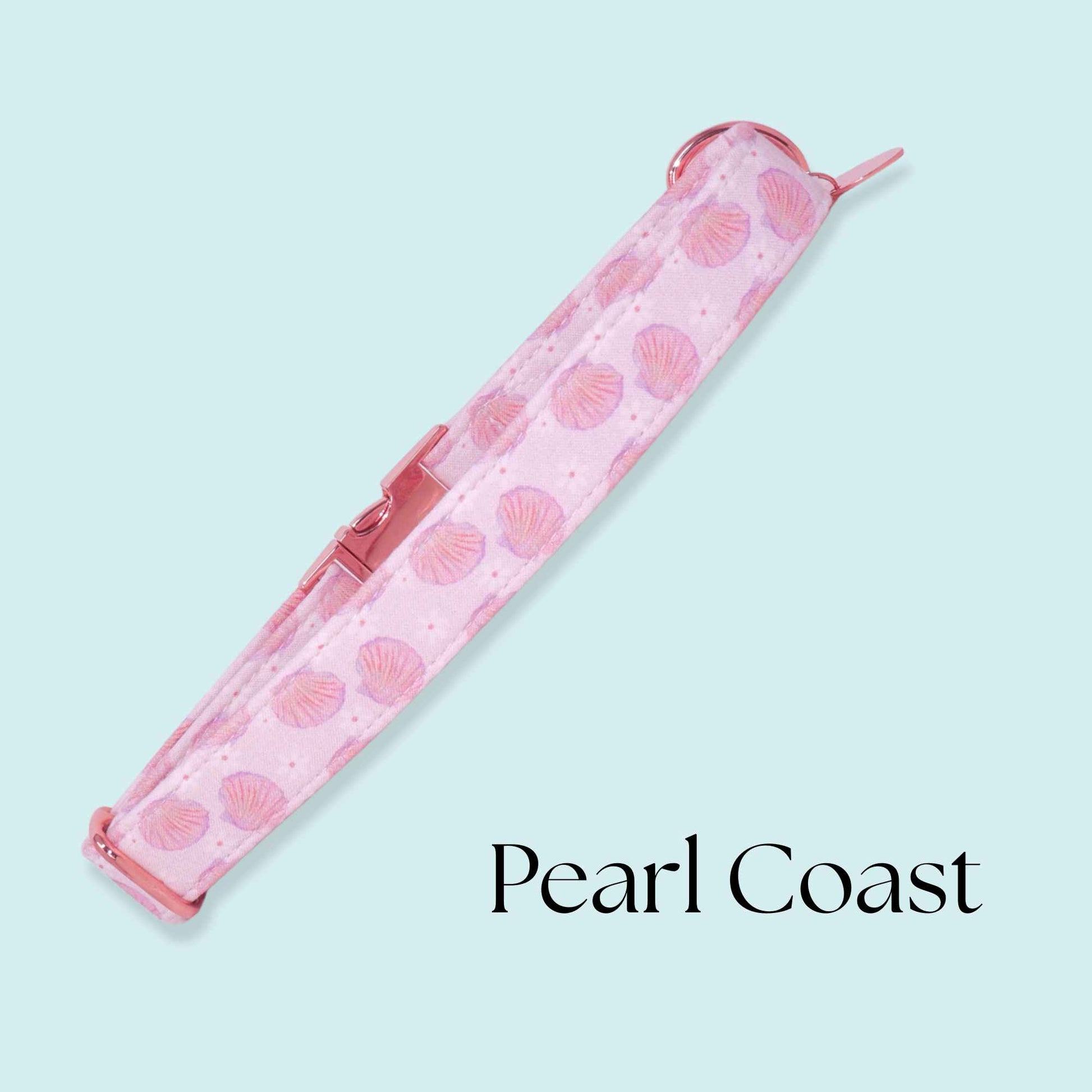 Handmade coastal dog collar with pink seashell print and rose gold buckle inspired by ocean and beach aesthetics