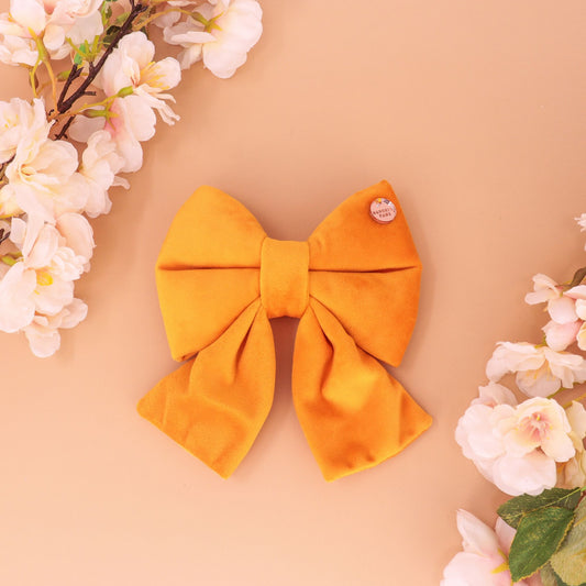 Handmade gold yellow velvet sailor bow for dogs with dual elastic attachment, premium German velvet, soft and durable pet collar accessory.
