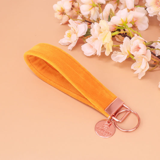 “Handmade gold yellow German velvet key fob wristlet with high-strength nylon core and key ring, soft and durable accessory for keys or charms.