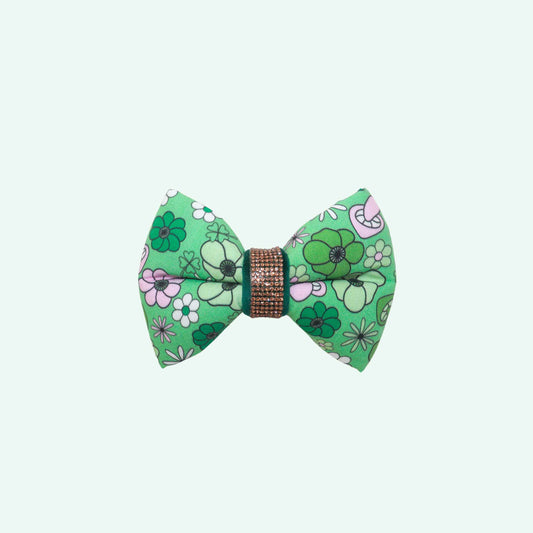 Irish Spring dog bowtie featuring green floral print with soft pink flowers, spring dog accessory