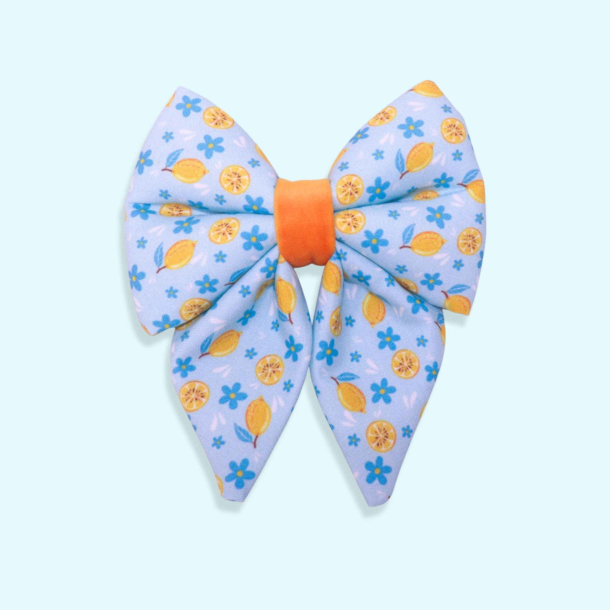 Lemon sailor dog bow with citrus pattern, blue flowers, and Mediterranean-inspired summer design from the Amalfi Breeze collection