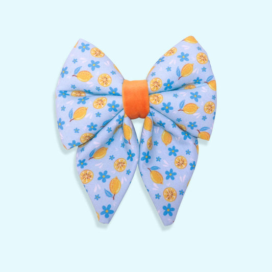 Lemon sailor dog bow with citrus pattern, blue flowers, and Mediterranean-inspired summer design from the Amalfi Breeze collection