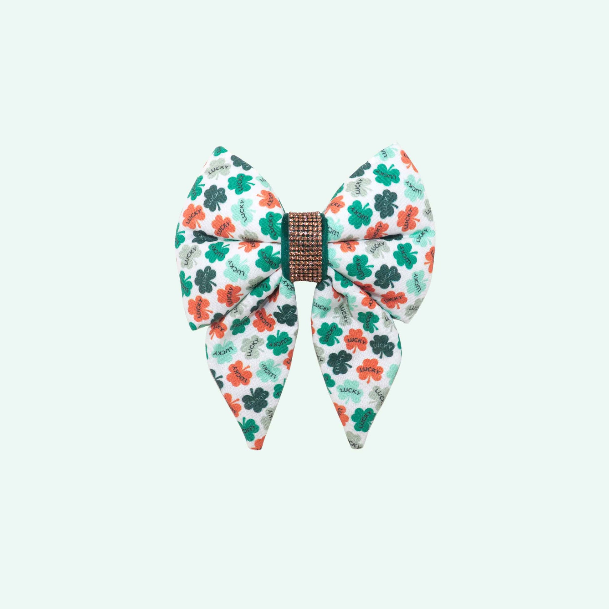 Lucky sailor dog bow with tails featuring clover print and lucky text, green St Patrick’s Day dog accessory
