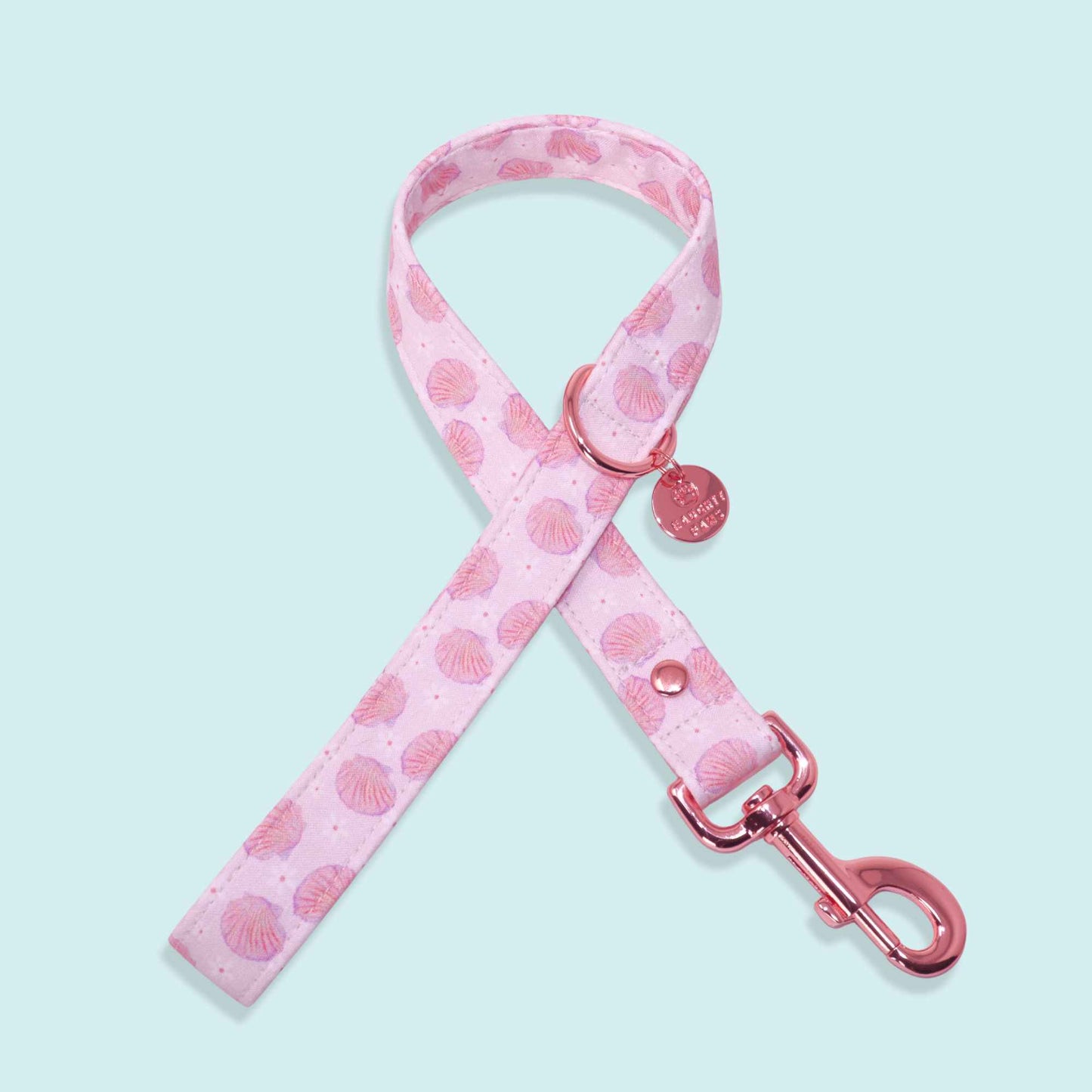 Pink seashell dog leash with rose gold hardware and coastal beach design from the Pearl Coast collection