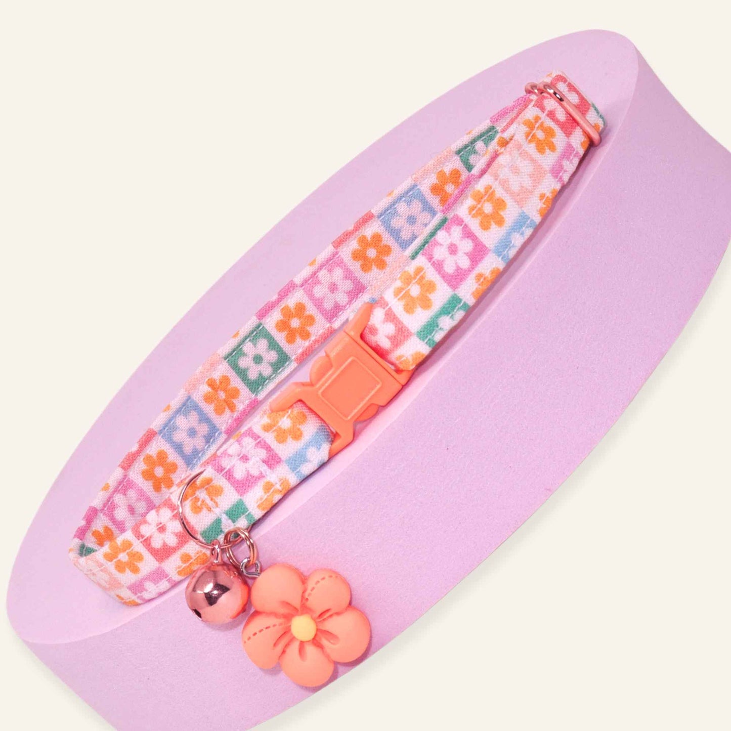 Retro floral checkered breakaway cat collar with pastel flower squares, rose gold hardware, and optional flower charm.
