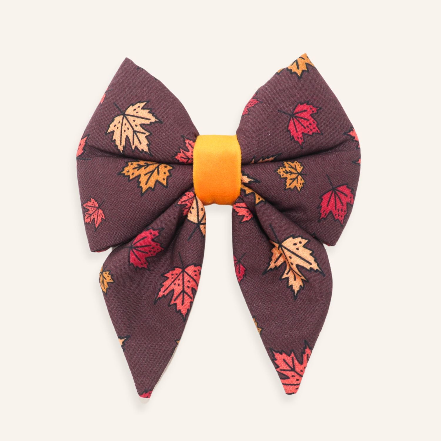 Falling Leaves autumn dog sailor bow with red, orange and yellow maple leaves on brown fabric
