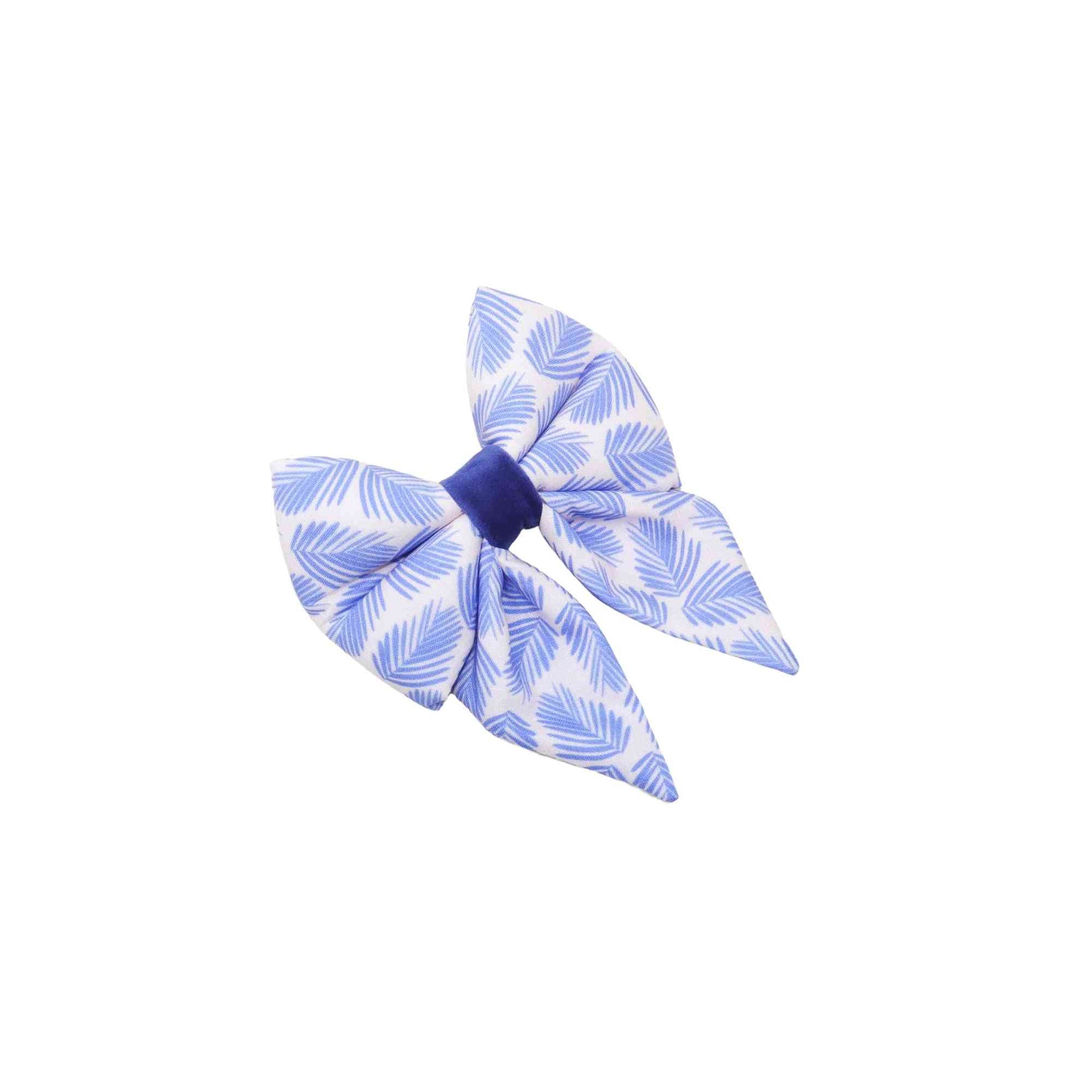 Add a touch of tropical paradise to your pup's summer wardrobe with our Blue Palms Tropical Dog Sailor Bow! This handmade bow is designed to slip easily over your pup's collar and comes in a range of sizes to fit dogs of all breeds and sizes. Made with high-quality fabric and expert craftsmanship, this bow is both durable and comfortable. The blue palms print is perfect for the summertime and adds a fun and vibrant touch to any outfit.
