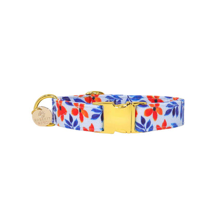 Crafted with care using high-quality materials, our collar is built to last and withstand the wear and tear of everyday use. The vibrant orange and blue floral pattern adds a pop of color to any outfit, making it the perfect accessory for sunny days and outdoor adventures. Whether you're taking your furry friend for a walk in the park or showing off their stylish new collar to friends and family, our "Bali" dog collar is sure to turn heads and make a statement.